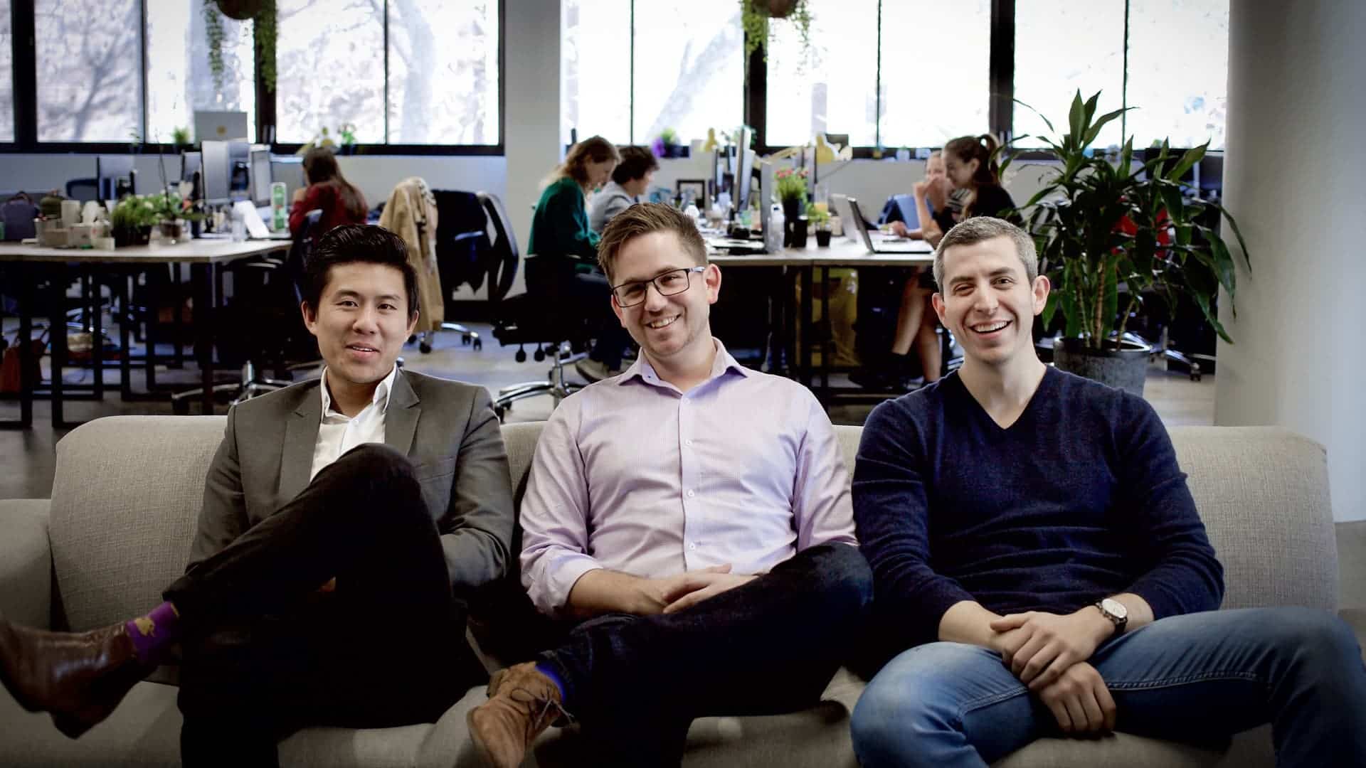 Photo of Ian Fong, Matthew Forzan and Michael Laps sitting on a sofa at the office